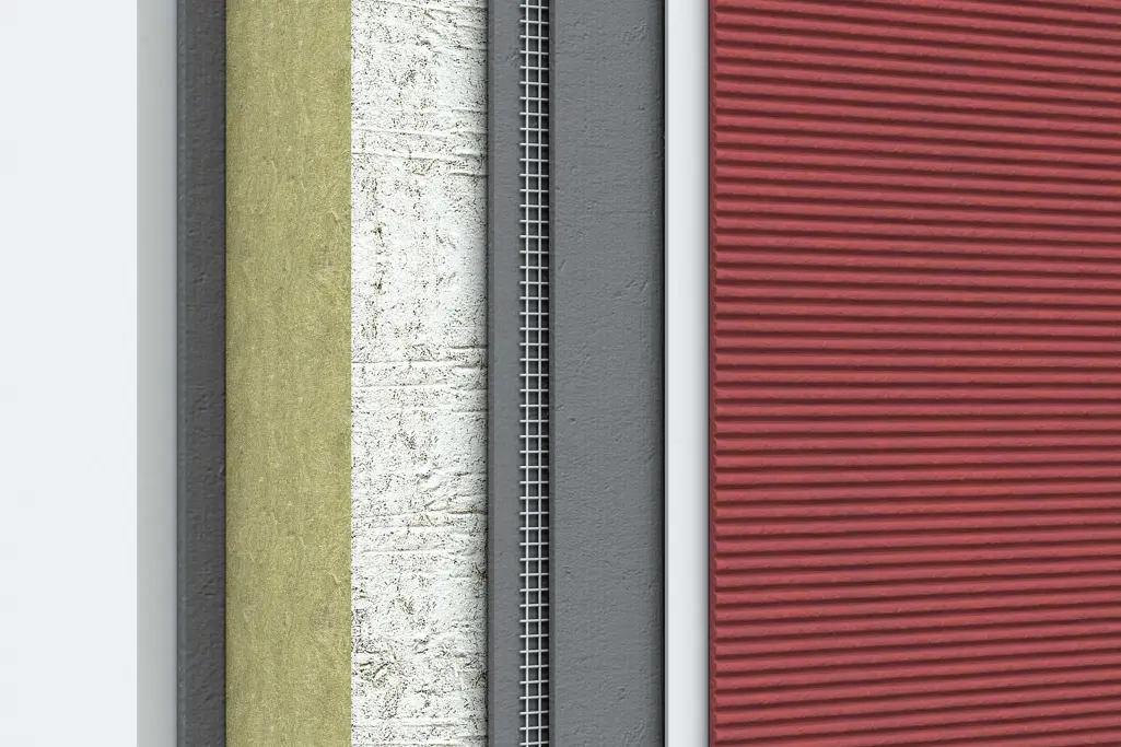 Prikaz preseka slojeva fasadne izolacije sa završnim crvenim slojem maltera.